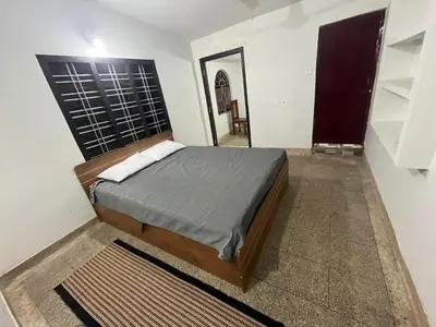 a bedroom with a bed in a room at VY3 Homes in Vythiri