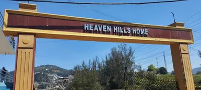 a wooden sign that reads the even halls house at VR Home Stay Ooty in Ooty