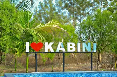a sign with a heart on it next to a pool at Tiger Woods Homestay Kabini in Antarasante