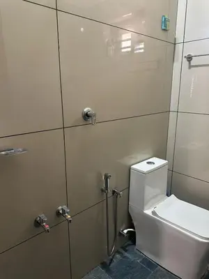 a bathroom with a toilet and a shower stall at AP'S Homestay Nilambur in Nilambūr