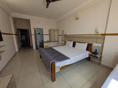 a bedroom with a large bed in a room at Pegasus Home in Coimbatore