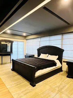 a bedroom with a large bed in a room at oakden lakkidi villa vythiri villa wayanad in Vythiri
