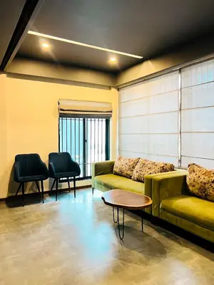 a living room with a couch and two chairs at oakden lakkidi villa vythiri villa wayanad in Vythiri