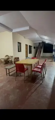 a room with a ping pong table and two chairs at Offline Resort in Bengaluru, Karnataka