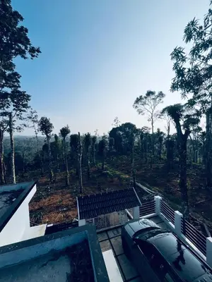 a house with a view of a forest at Stay loop in Cherambādi