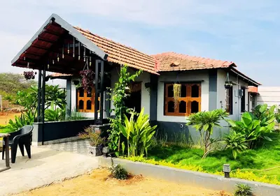 a small house with a pathway leading to it at Sol Malai Retreat near MM Hills by Travent Mug