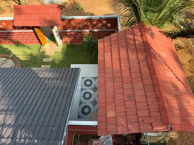 an overhead view of a house with a red roof at Dhani Nature Stay in PÄndavapura