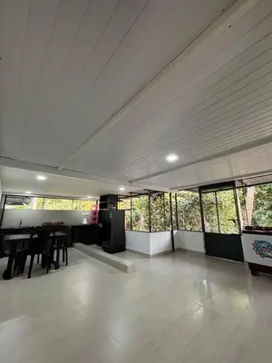 a large room with a table and some windows at Sawan house in Tāzhekkod