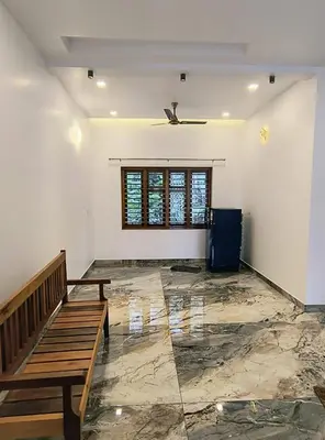 a empty room with a bench and a window at Riverbend Retreat in Kozhikode