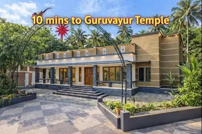 a house with a sign that reads mins to guivuri temple at Luxury Garden Villa, Free Breakfast in Guruvayoor in Manattala