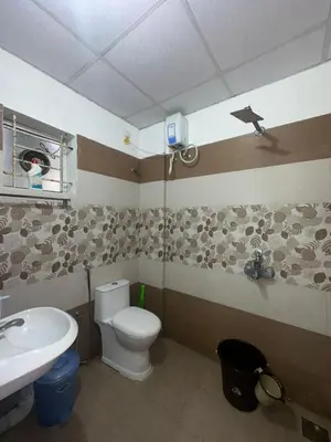 a bathroom with a toilet and a sink at 1bhk Kalp 200m temple Thulasi nagar in Guruvāyūr