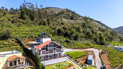 an aerial view of a house on a hill at Orchid Villa Kotagiri in Kodanād