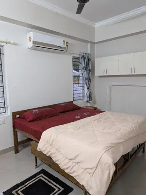 a bedroom with a large bed in a room at Eva's Homestay at Cherai in North Paravur