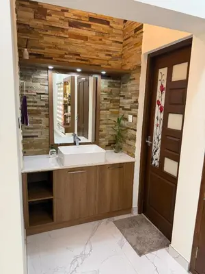 a bathroom with a sink and a mirror at Premium house near Cochin Airport for NRI families in Nedumbassery