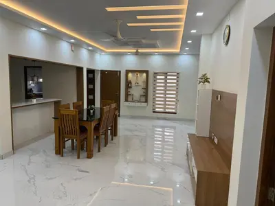 a dining room with a table and chairs at Premium house near Cochin Airport for NRI families in Nedumbassery