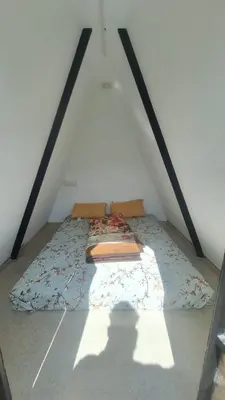 a bed in the attic of a room at Secret valley vattavada in Vattavada