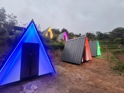 a group of colourful tents in a field at Secret valley vattavada in Vattavada