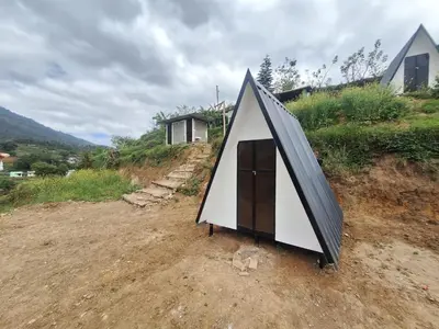 a small tent sitting on top of a hill at Secret valley vattavada in Vattavada
