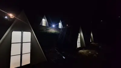 a church at night with lights in the dark at Secret valley vattavada in Vattavada
