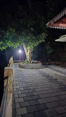 a street light in a park at night at Happy Home Stay in Palakkad