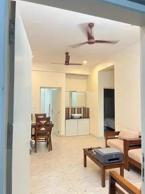 a living room with a couch and a table at Serenity Homes near Rajagiri Hospital in Alwaye