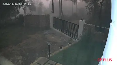 an aerial view of a yard with a fence at Shade trees in Padinjarathara