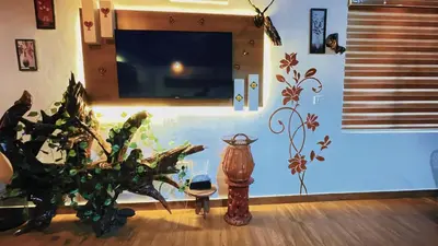 a living room with a vase and a plant at Pepper Valley Resort in Kalpetta