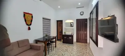 a living room with a couch and a table at Krishna stays in Manattala