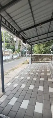 an empty parking lot with a covering on a street at Krishna stays in Manattala