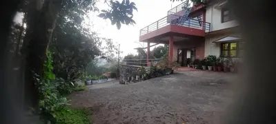 a view from a window of a house at Roshan Homestay in Madikeri
