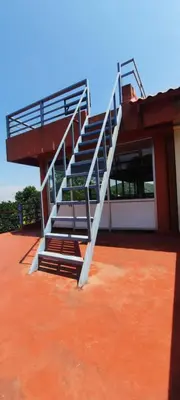 a staircase on the side of a building at Roshan Homestay in Madikeri