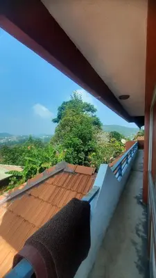 a view from the balcony of a house at Roshan Homestay in Madikeri