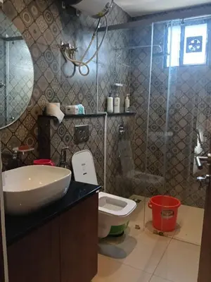 a bathroom with a sink and a toilet at Rajarajeshwari Farm Stay in Sivasamudram