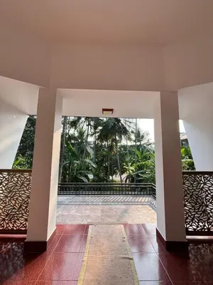 an empty lobby with a view of a pool at Sawan Homestay in Tāzhekkod