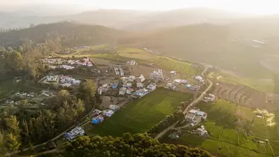 an aerial view of a park with houses and trees at Nature'call homestay in Ooty