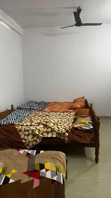 a bedroom with a bed in a room at Aneesh Arcade in Kollengode