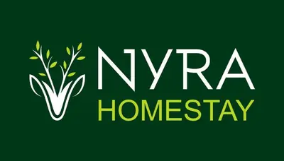 a green sign with the words nvarma homesay at Nyra homestay in Kushālnagar