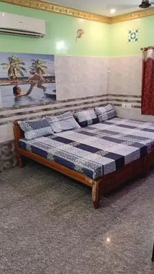 a bedroom with a large bed in a room at VR Residency in Wodapatti