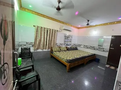 a bedroom with a bed in a room at VR Residency in Wodapatti