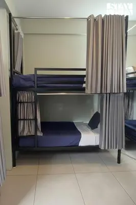 a couple of bunk beds in a room at StayVista at Lagoons Kuruva with Shared Pool, Lawn in Chekadi