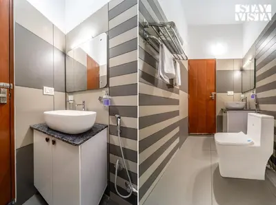 a bathroom with a sink and a toilet at StayVista at Lagoons Kuruva with Shared Pool, Lawn in Chekadi