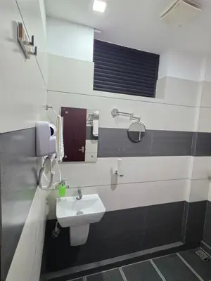 a bathroom with a sink and a mirror at Dream wagon hotel lakkidi in Vythiri