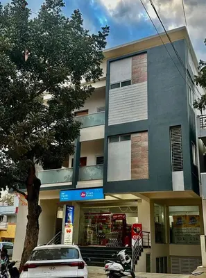 a car parked in front of a building at Dakshima Residency in Mysore