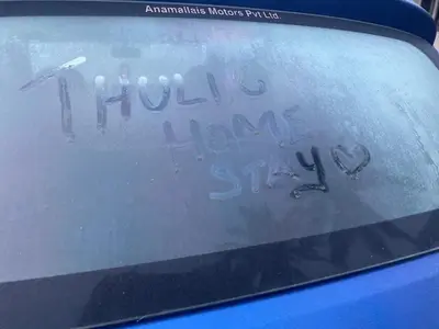 a car window with the words hello have a heartasy sign at Thulir Farm Stay Near Isha Yoga Adiyogi in Coimbatore