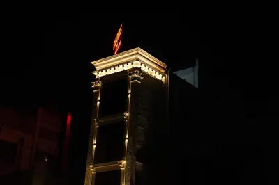 a building with lights on top of it at night at The Grand Sarayu in Mysore
