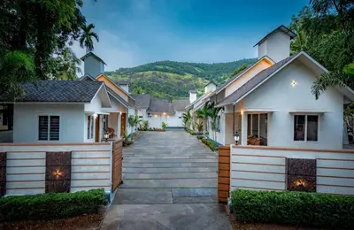 a house with a pathway leading to it at New Abrigo Resorts in Perintalmanna