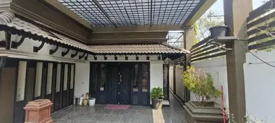 an entrance to a house with a black door at Majestic Mirage Service Villa in Kalpetta