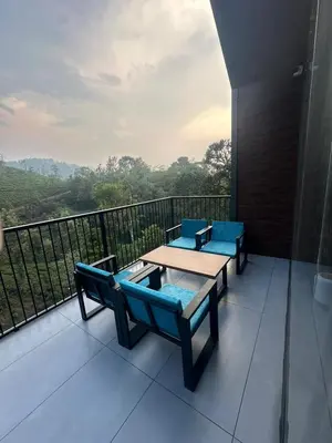 a balcony with a table and chairs and a view at Velora Hotel And Resorts in Devāla