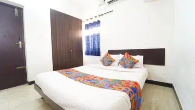 a bedroom with two beds in a room at Thai Residency in Coimbatore