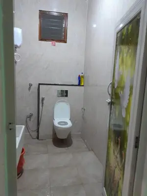 a small bathroom with a toilet and a sink at 4 Beds 6 People stay Calm, Comfortable Place in Mysore